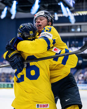 Lucas Raymond and Rasmus Dahlin of Sweden celebrate the 1-0