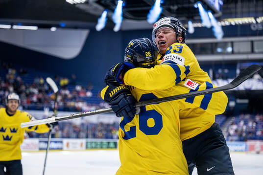 Lucas Raymond and Rasmus Dahlin of Sweden celebrate the 1-0
