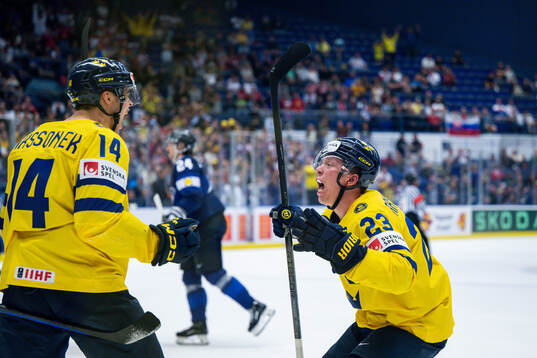 Joel Eriksson Ek and Lucas Raymond of Sweden celebrates