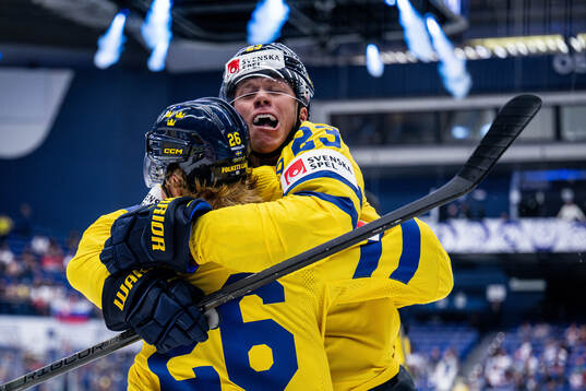 Lucas Raymond and Rasmus Dahlin of Sweden celebrate the 1-0