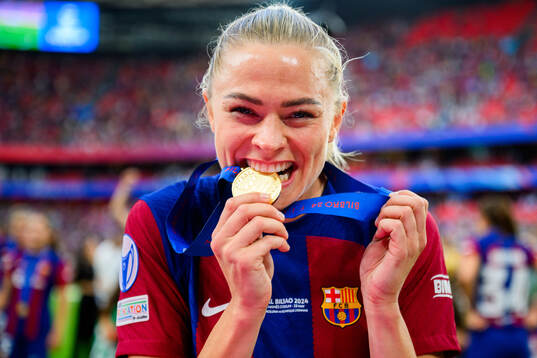 Fridolina Rolfö of Barcelona celebrates with her gold medal
