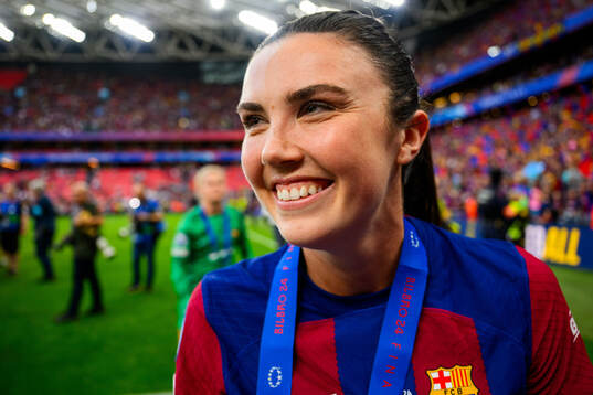 Ingrid Syrstad Engen of Barcelona celebrates with her gold medal