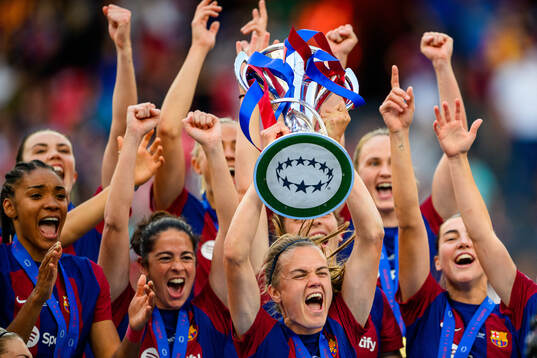 Irene Paredes of Barcelona lifts the trophy