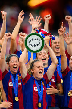Irene Paredes of Barcelona lifts the trophy