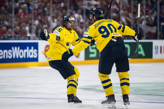 Marcus Johansson of Sweden celebrates with Erik Karlsson