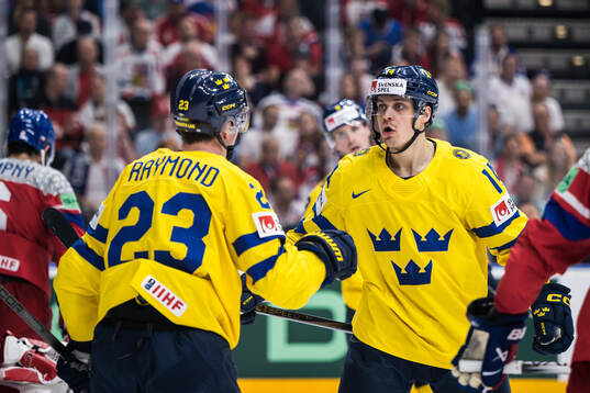 Lucas Raymond and Joel Eriksson Ek of Sweden celebrate