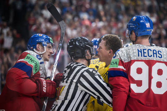 Dominik Kubalik of Czech Republic fights with Lucas Raymond