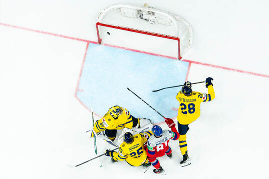 Goaltender Filip Gustavsson, Marcus Pettersson and Jonas