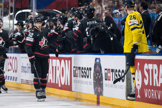 Dylan Cozens of Canada celebrates