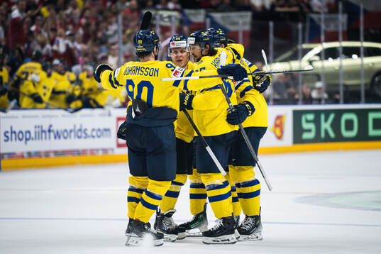 Erik Karlsson of Sweden celebrates with team mates
