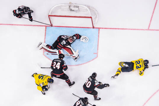 Goaltender Jordan Bennington of Canada and Lucas Raymond of