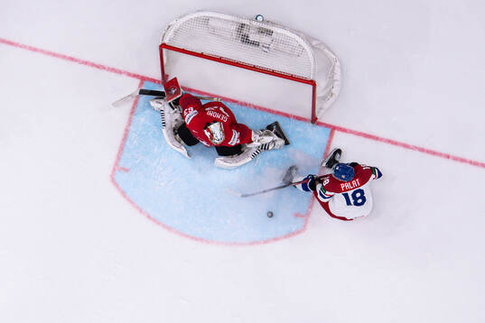 Goaltender Leonardo Genoni of Switzerland and Ondrej Palat