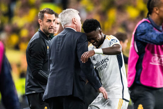 Vinicius Junior of Real Madrid celebrate with Head coach Carlo Ancelotti after scoring the 0-2 goal