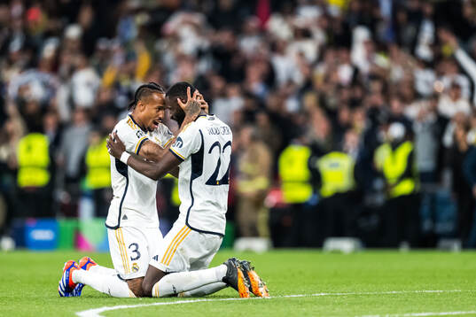 Eder Militao and Antonio Rudiger of Real Madrid celebrate