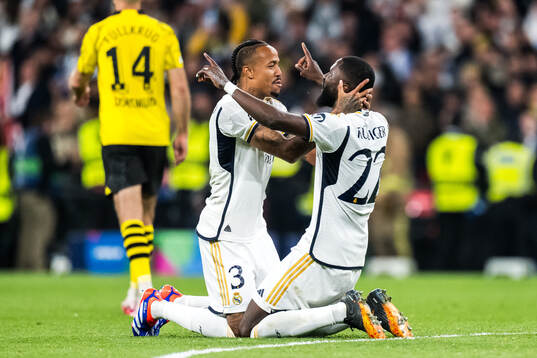 Eder Militao and Antonio Rudiger of Real Madrid celebrate