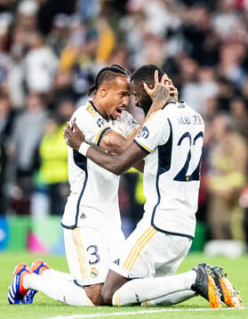 Eder Militao and Antonio Rudiger of Real Madrid celebrate