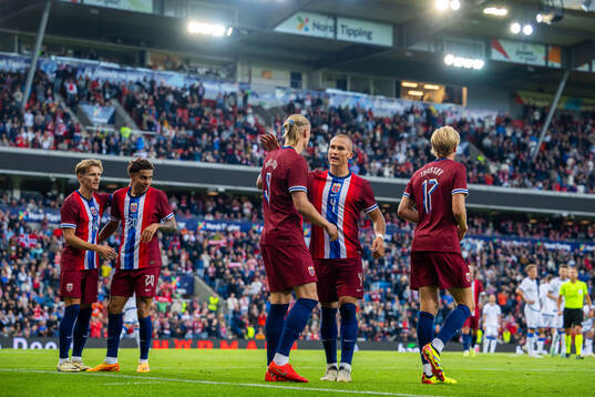 Erling Braut Haaland of Norway celebrates with teammate Leo Østigård after scoring 2-0