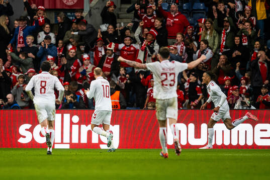 Yussuf Poulsen of Denmark celebrate with teammates