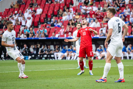 Christian Eriksen of Denmark reacts