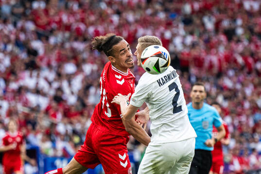 Yussuf Poulsen of Denmark and Zan Karnicnik of Slovenia