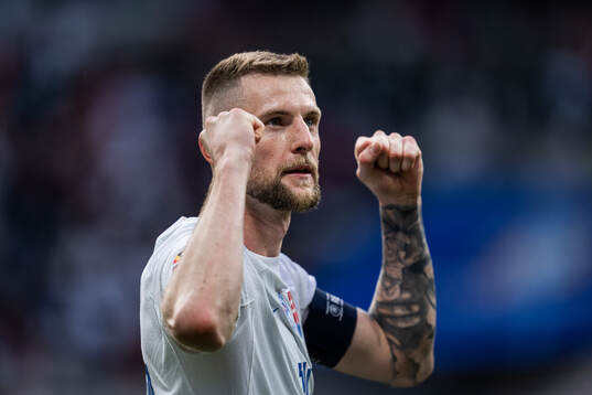 Milan Skriniar of Slovakia celebrates