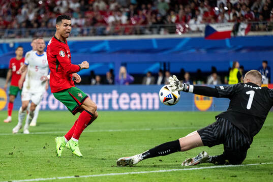 Cristiano Ronaldo of Portugal and goalkeeper Jindfich