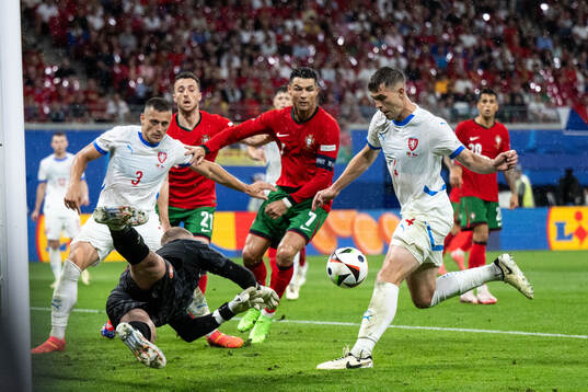 Goalkeeper Jindfich Stanek and Robin Hranac of Czech