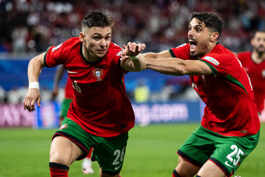 Francisco Conceicao and Pedro Neto of Portugal celebrate after 2-1