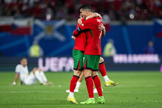 Francisco Conceicao and Cristiano Ronaldo of Portugal celebrate
