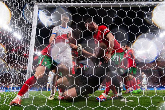 Goalkeeper Jindfich Stanek of Czech Republic fights with