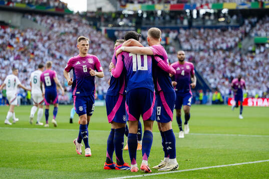 Jamal Musiala of Germany celebrates with teammates