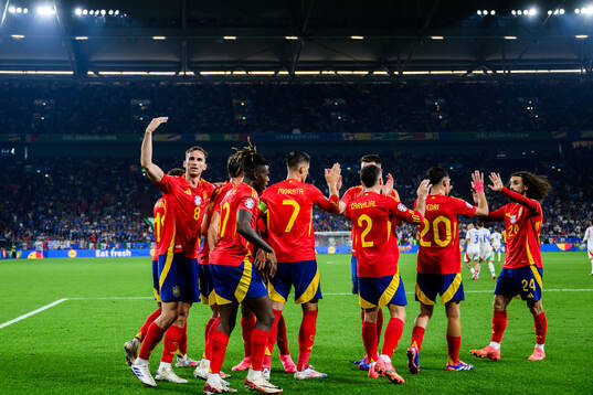 Players of Spain celebrate after 1-0