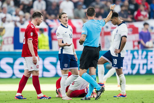 Conor Gallagher of England reacts towards referee Artur