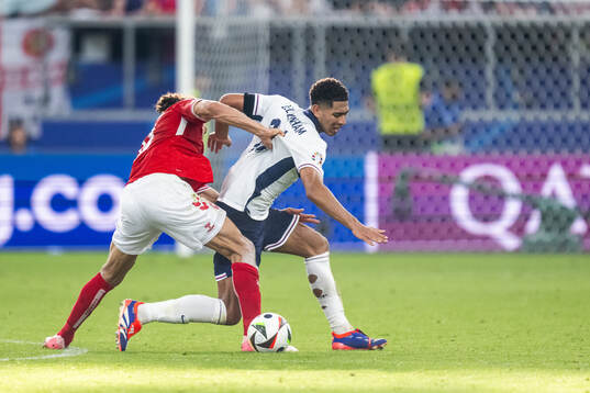 Yussuf Poulsen of Denmark and Jude Bellingham of England