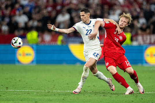 Sasa Lukic of Serbia and Kasper Dolberg of Denmark