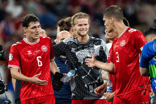 Andreas Kristiansen, Morten Hjulmand and Jannik Vestergaard of Denmark celebrate