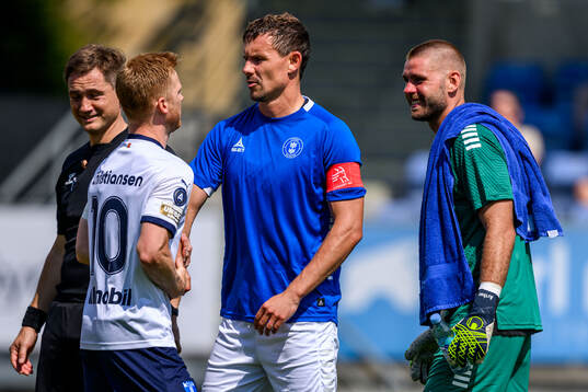 Malmö FFs Anders Christiansen och Lyngbys Andreas Bjelland och målvakt Jannich Storch