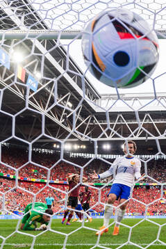 Goalkeeper Koen Casteels and Timothy Castagne of Belgium and Antoine Griezmann of France