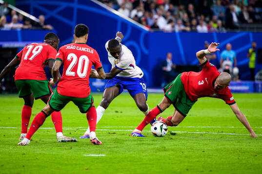 Randal Kolo Muani of France and Pepe of Portugal