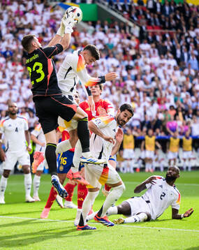 Goalkeeper Unai Simon Mendibil of Spain against Kai Havertz