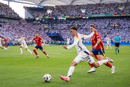 Jamal Musiala of Germany and Fabian Ruiz Pena of Spain