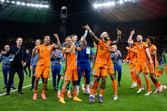 Xavi Simons and Memphis Depay of Netherlands  celebrate after the UEFA Euro 2024 Football Championship quarterfinal between Netherlands and Turkey on July 6, 2024 in Berlin. 
