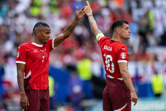 Manuel Akanji and Granit Xhaka of Switzerland