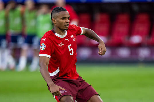 Manuel Akanji of Switzerland shoots a penalty