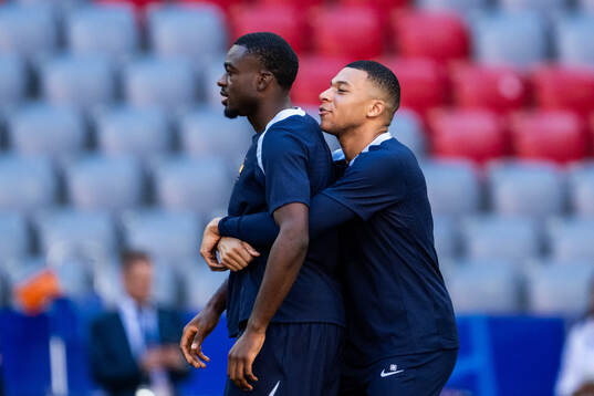 Youssouf Fofana and Kylian Mbappé at a training session