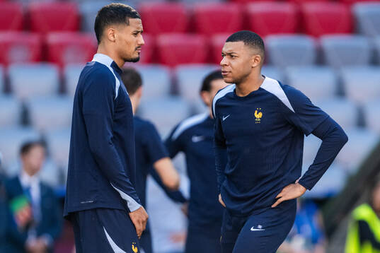William Saliba and Kylian Mbappé at a training session