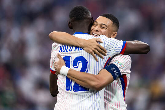 Randal Kolo Muani and Kylian Mbappé of France celebrate