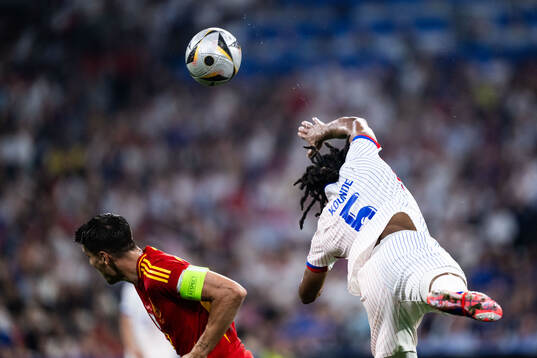 Alvaro Morata of Spain and Jules Koundé of France
