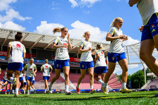 My Cato and Sofia Jakobsson of the Swedish women's national football team warm up at a training session