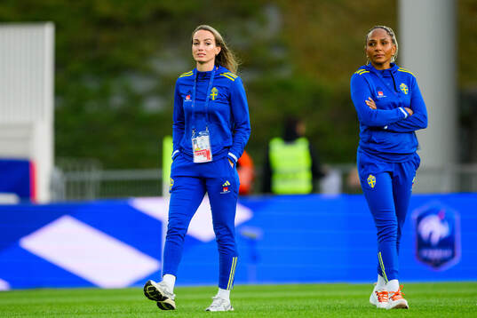 Kosovare Asllani and Madelen Janogy of Sweden walks the pitch ahead of the UEFA Women's Euro qualifying football match between France and Sweden on July 12, 2024 in Dijon. 